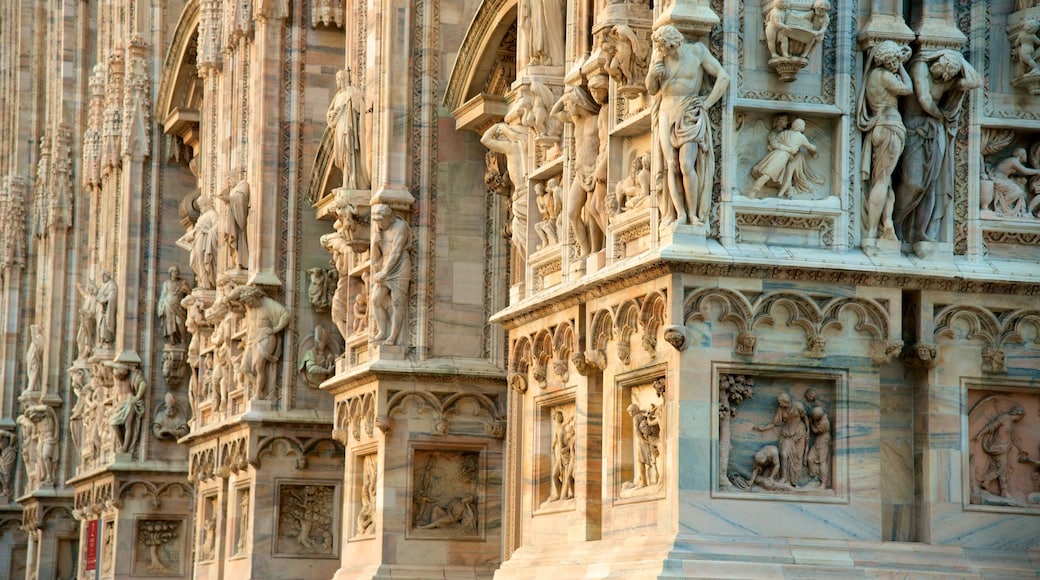 Cathedral of Milan which includes a statue or sculpture, a church or cathedral and heritage architecture