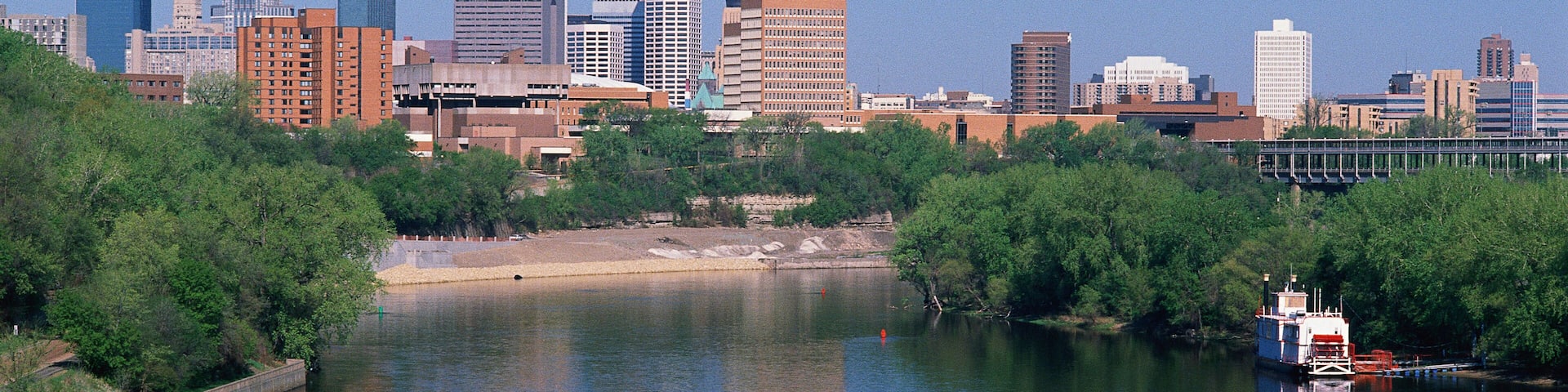 A river with a city skyline in the background.