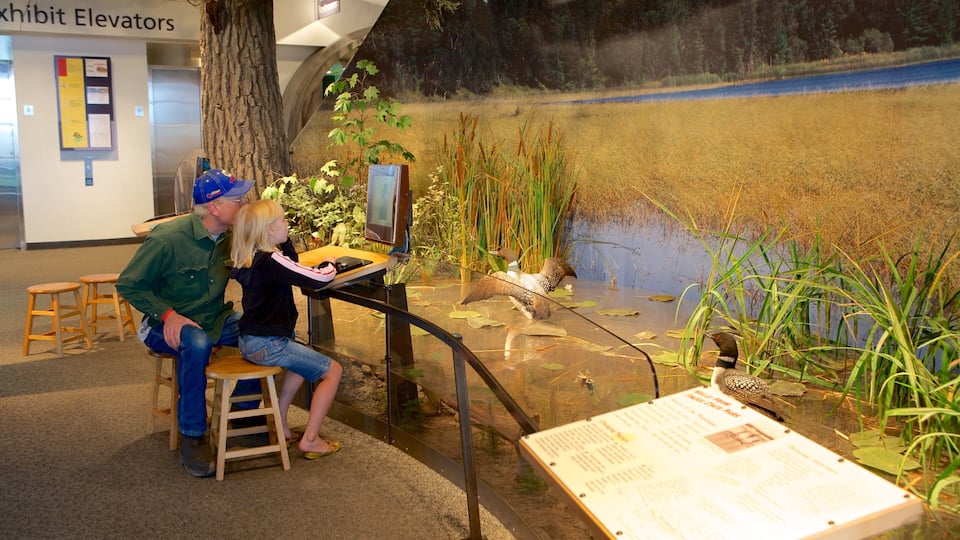 Science Museum of Minnesota featuring interior views as well as a family