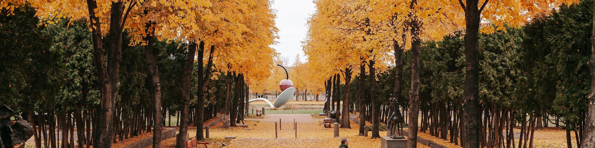 Walker Art Center featuring a garden and autumn leaves as well as an individual male
