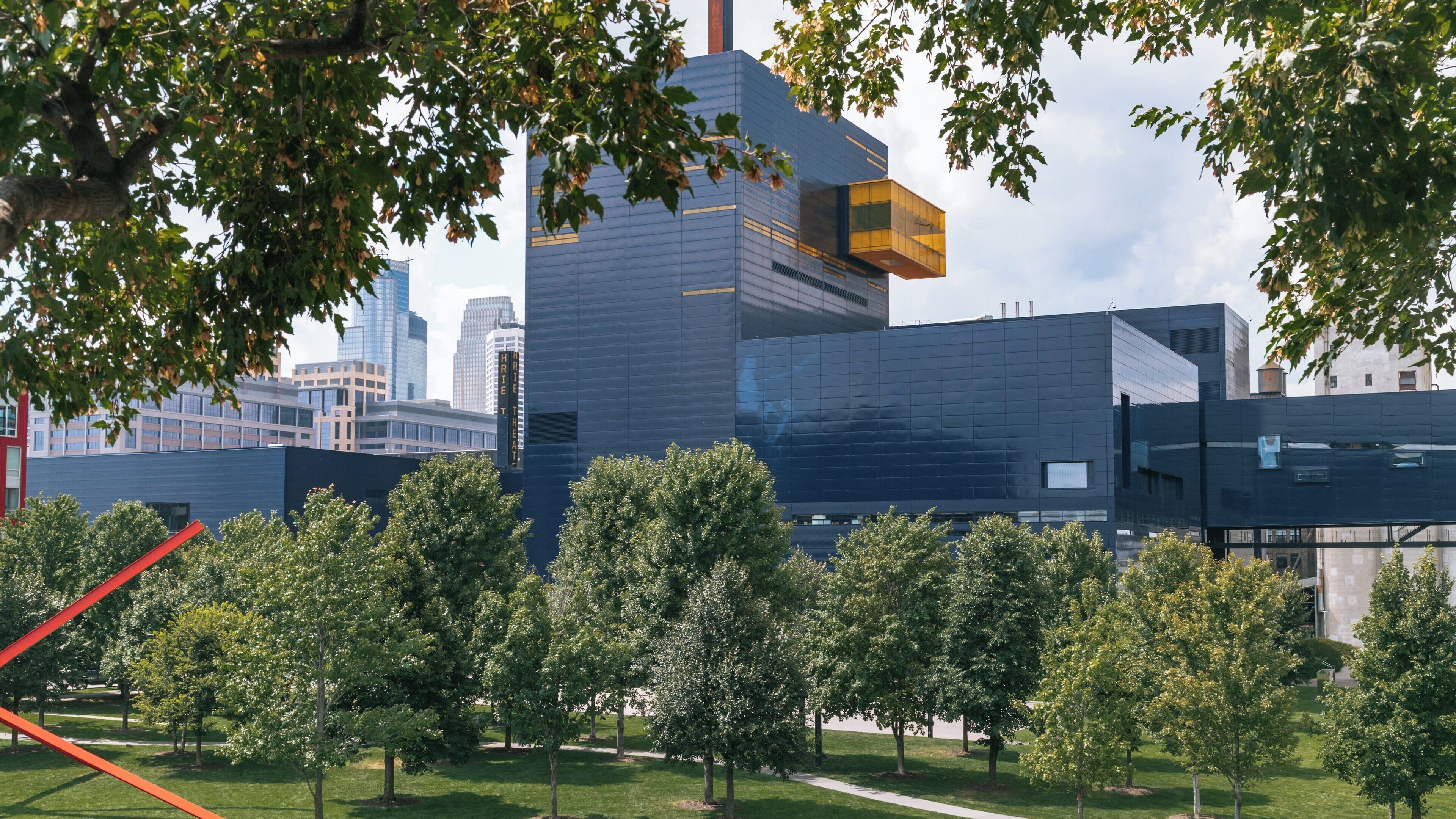 Guthrie Theater showcases modern architecture and vibrant greenery in Downtown Minneapolis, Minnesota on a sunny day