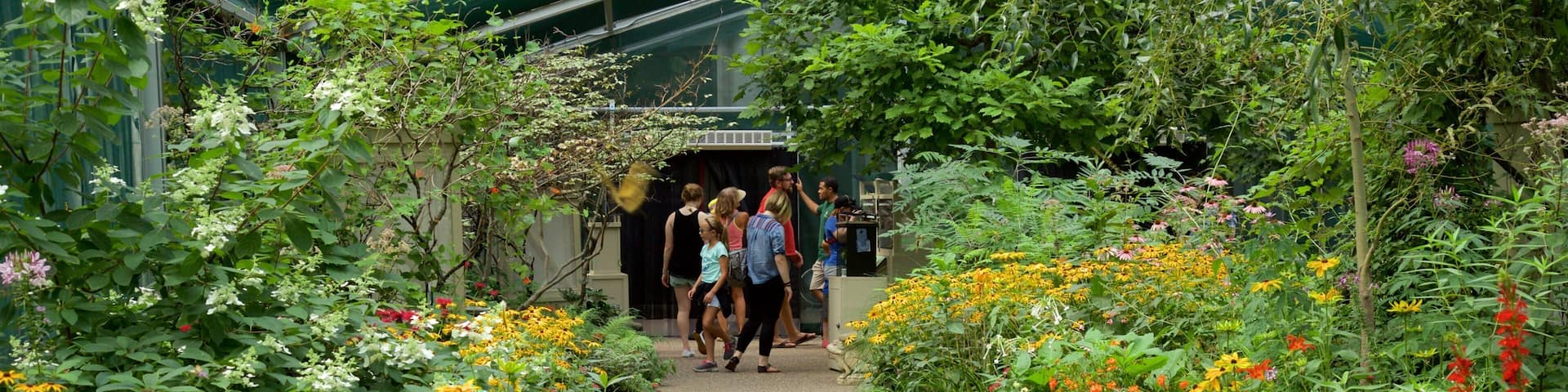 Minnesota Zoo featuring wildflowers, a park and interior views