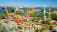 La Ronde Six Flags which includes a bay or harbour, rides and a city