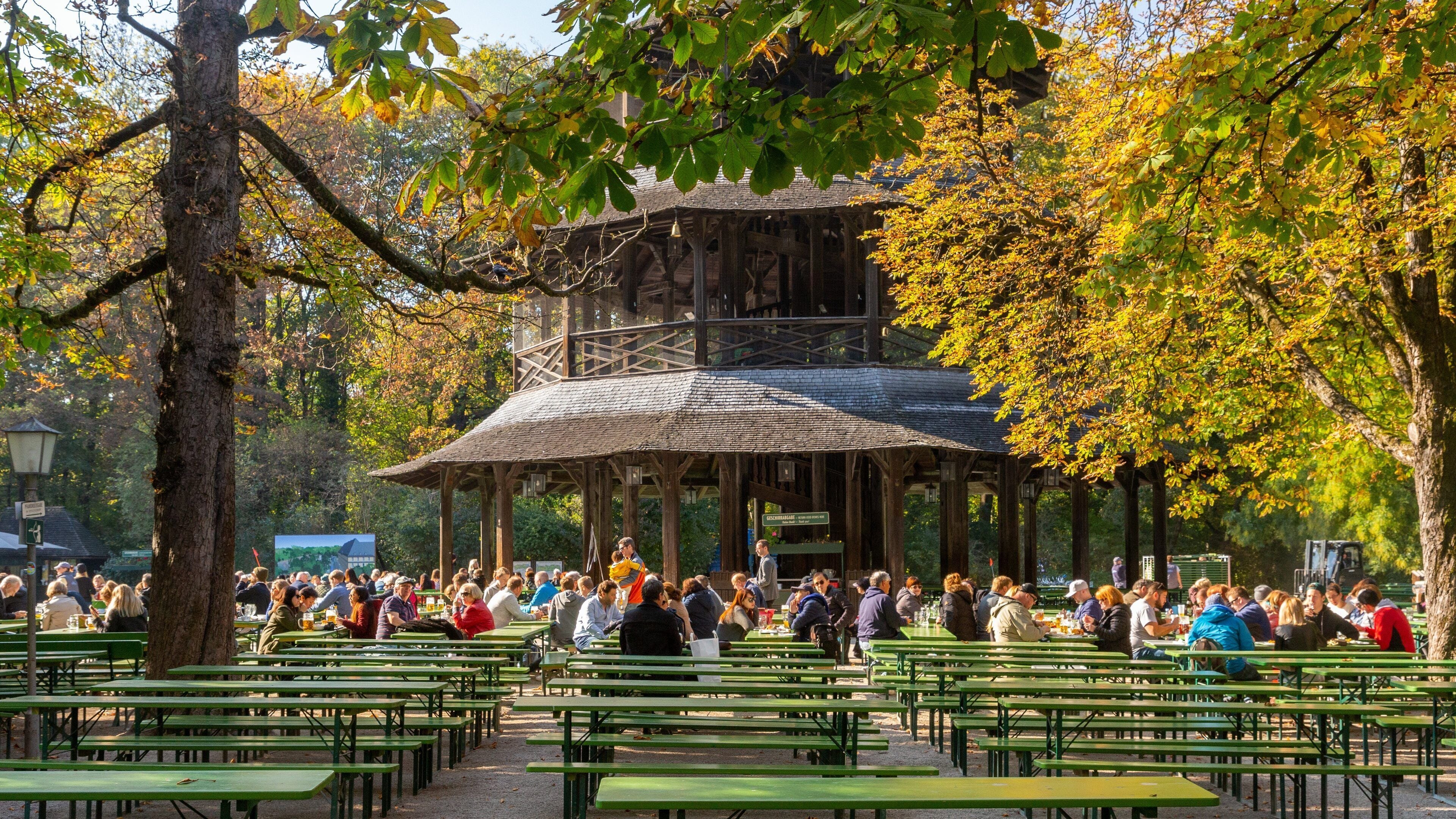 Chinesischer Turm featuring outdoor eating and heritage architecture as well as a large group of people