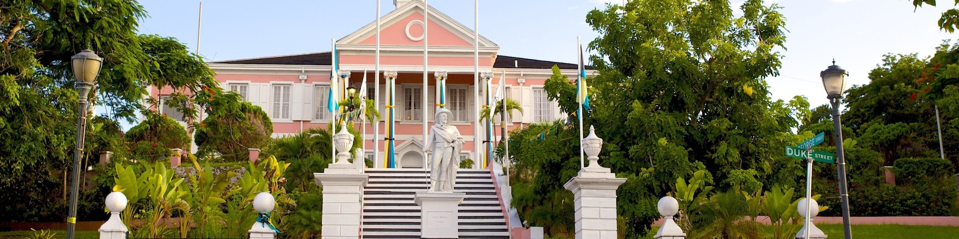 Government House featuring a statue or sculpture and an administrative buidling