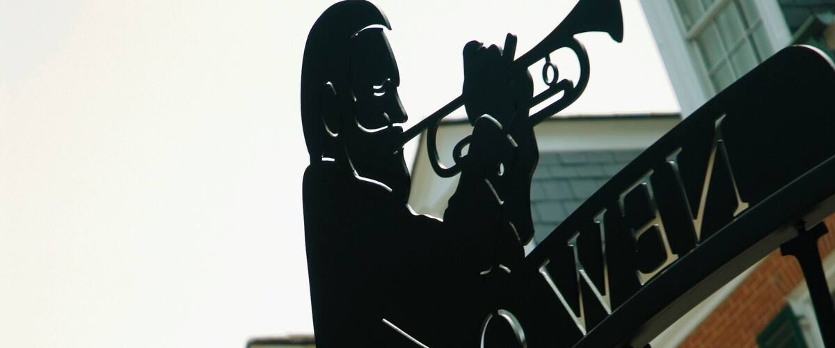 Low angle view of the statue of a man playing the trumpet, New Orleans, Louisiana, USA