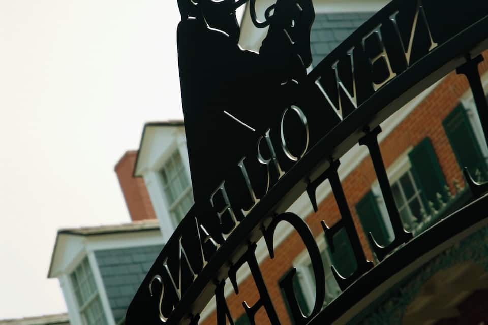 A silhouette of a person playing a trumpet with the text "NEW YORK" on a metal structure.