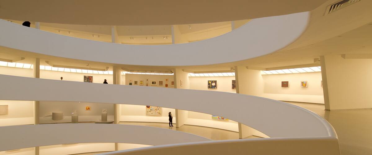 Solomon R. Guggenheim Museum featuring art and interior views