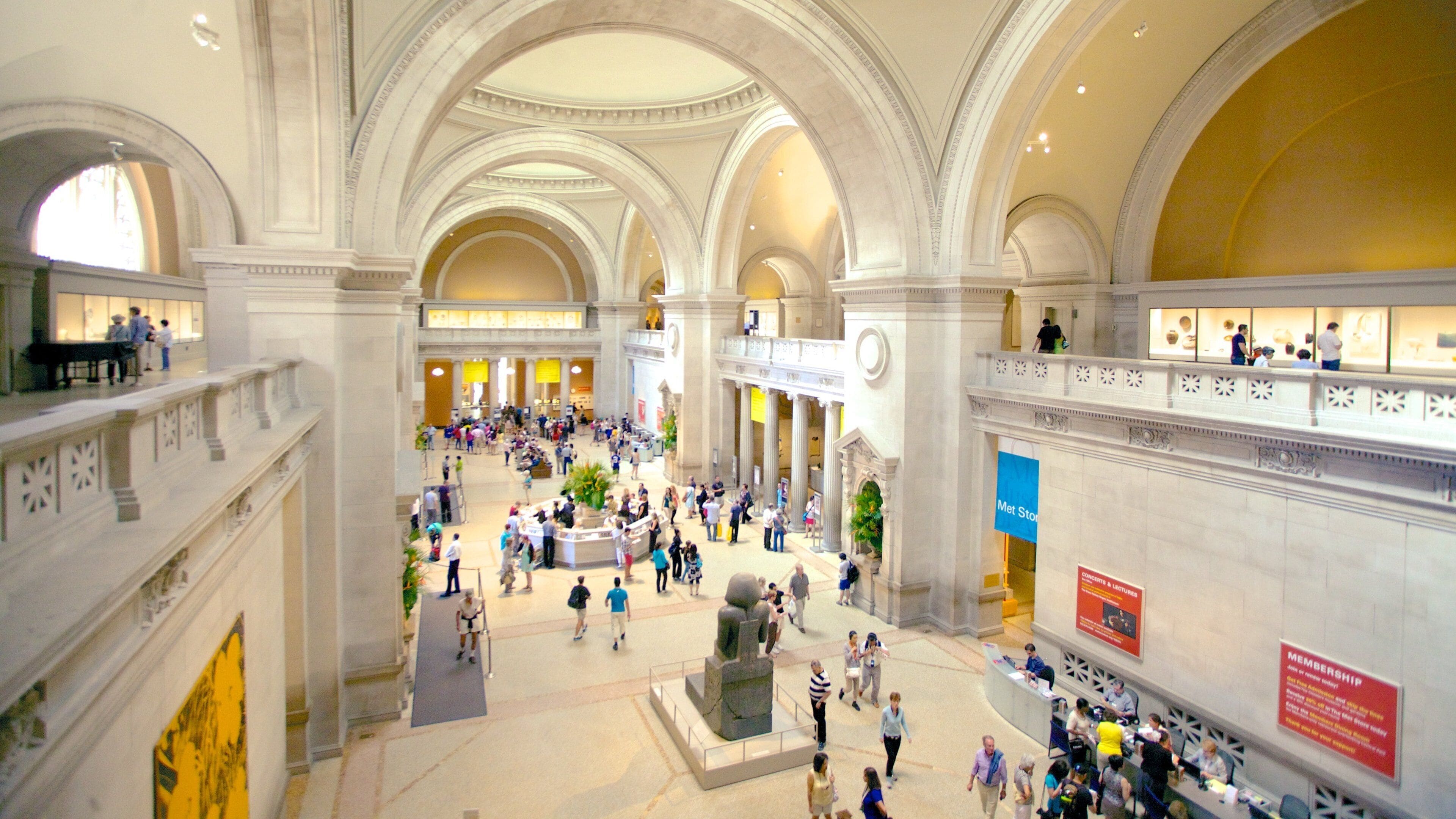 Metropolitan Museum of Art featuring art and interior views as well as a large group of people