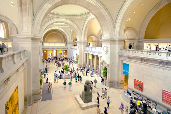 Metropolitan Museum of Art featuring art and interior views as well as a large group of people