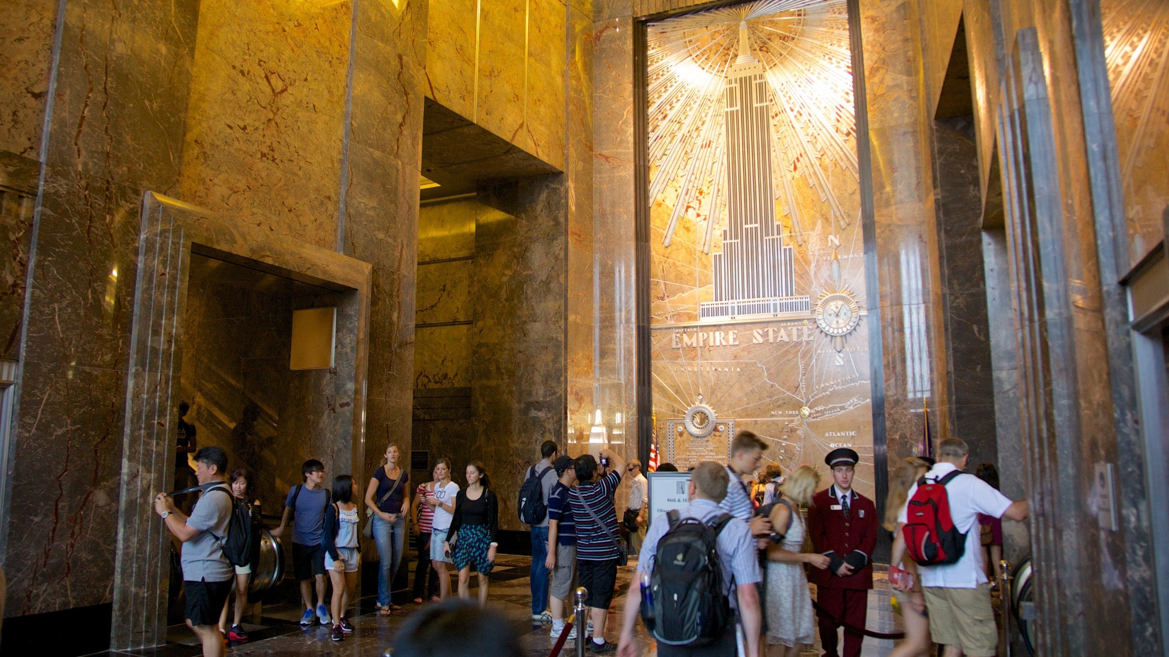 Empire State Building showing interior views as well as a large group of people