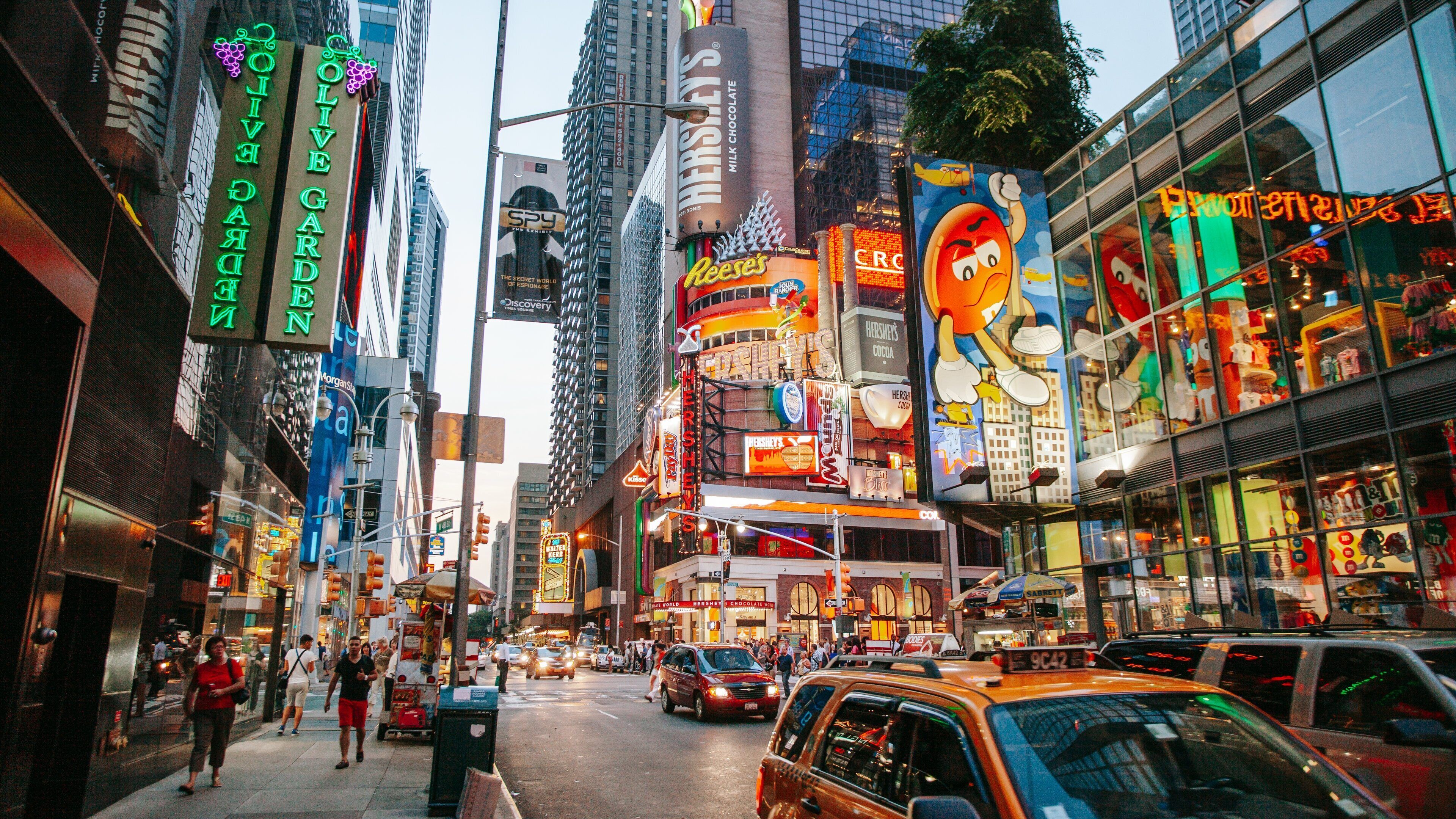 Times Square featuring signage, a city and street scenes