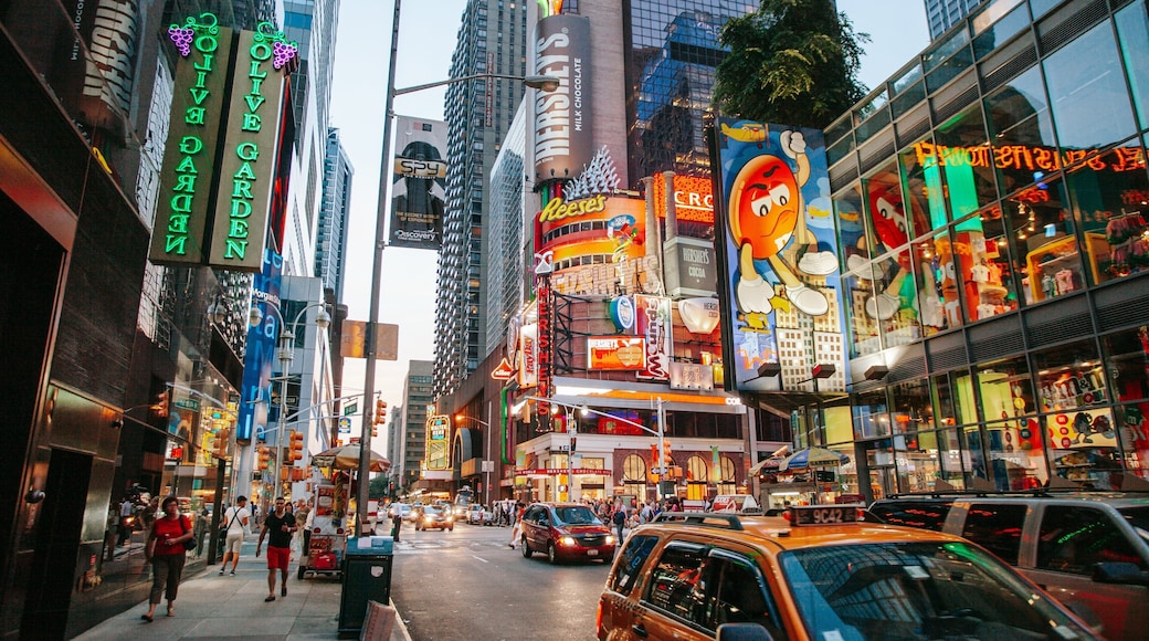 Times Square featuring signage, a city and street scenes