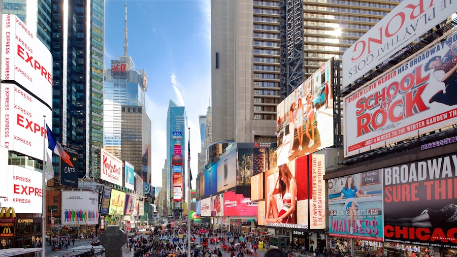 Times Square which includes a city, signage and a high rise building