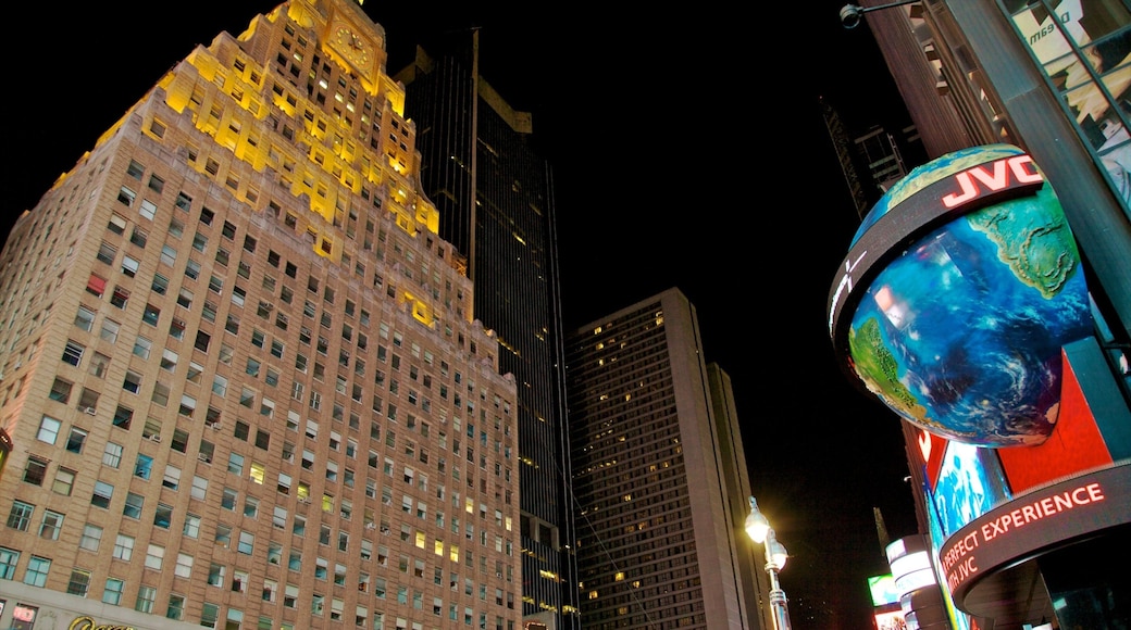 Vibrant lights illuminate Times Square at night in New York City, showcasing bustling activity and iconic architecture