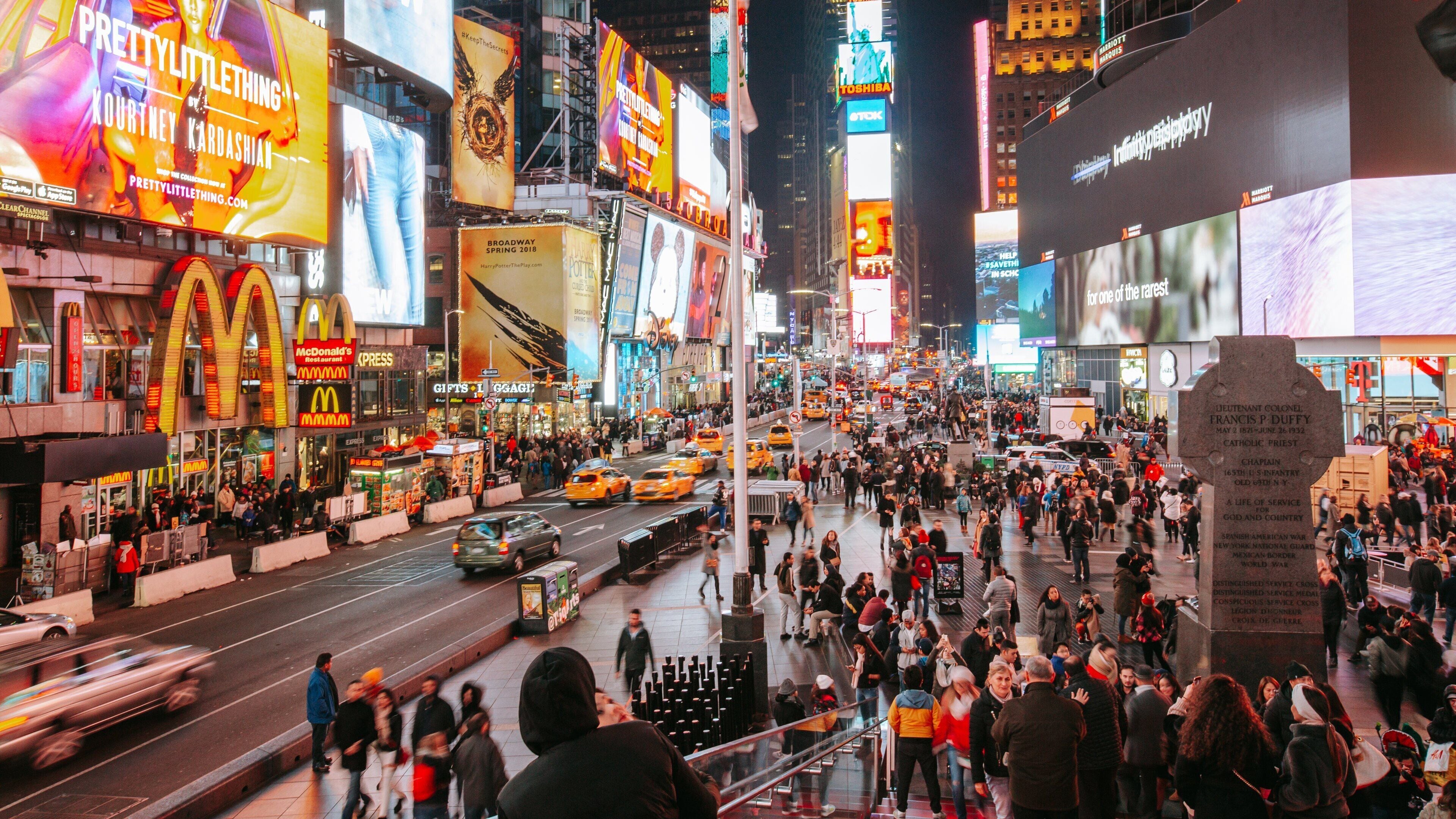Times Square which includes a city, city views and signage