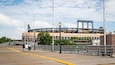 Citi Field featuring street scenes as well as a small group of people