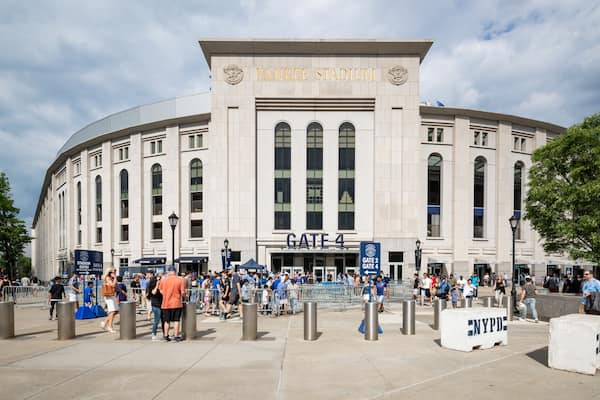 Yankee Stadium featuring signage and street scenes