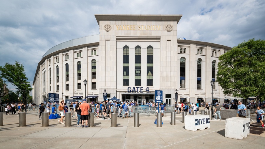 Yankee Stadium featuring signage and street scenes