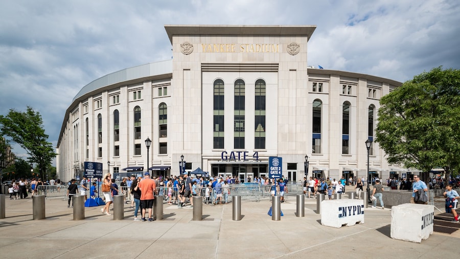 Yankee Stadium featuring signage and street scenes