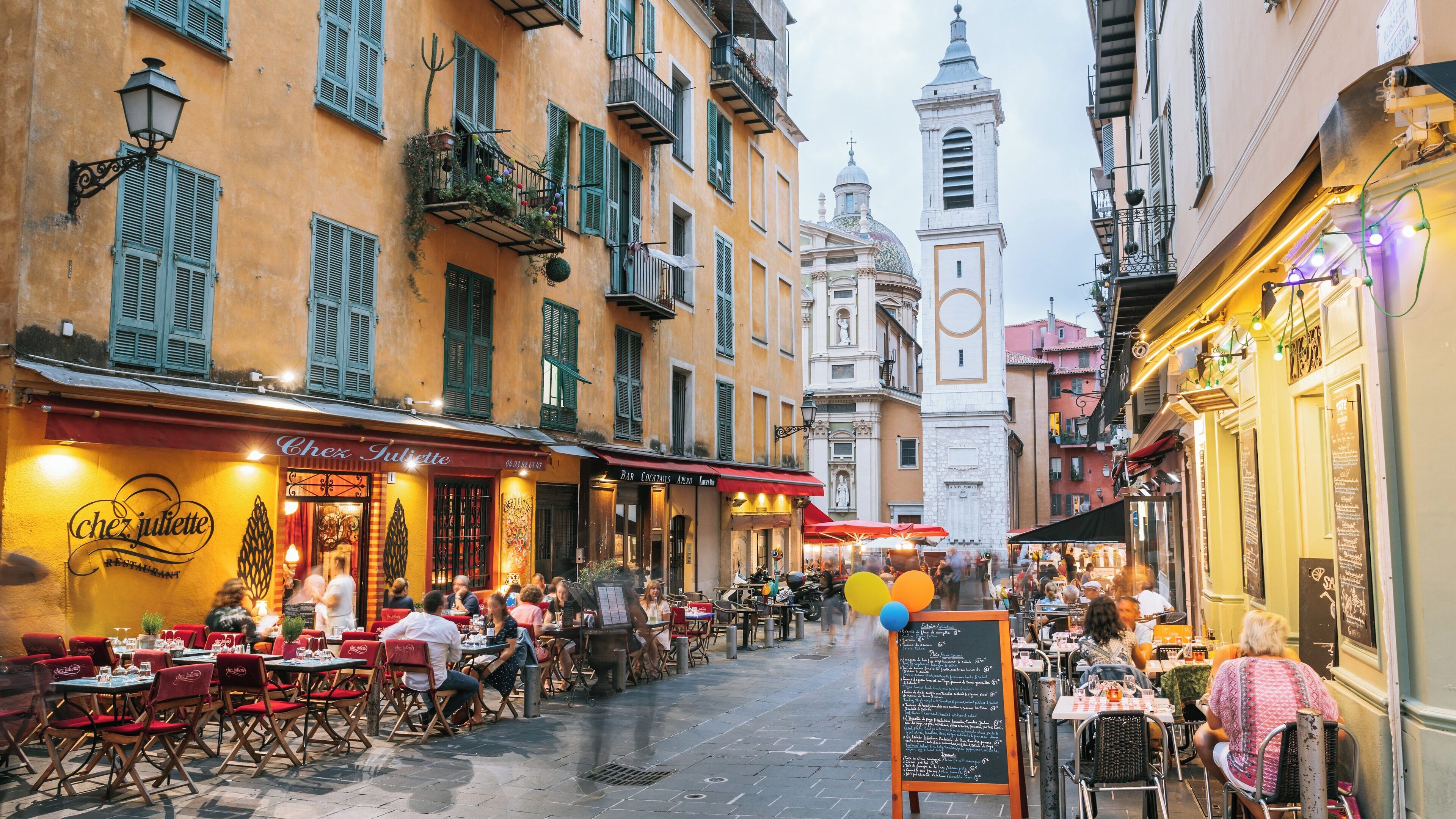 Enjoying the vibrant atmosphere of Nice Cathedral in Old Town Nice, Provence-Alpes-Côte d'Azur during a lively evening