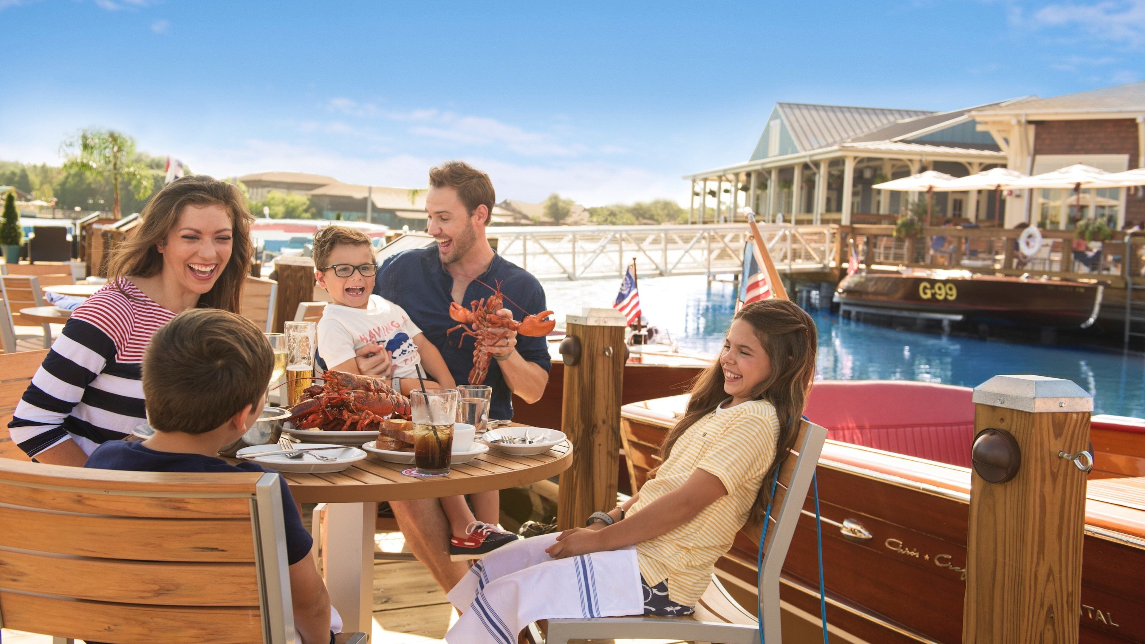 Disney Springs® featuring food and dining out as well as a family