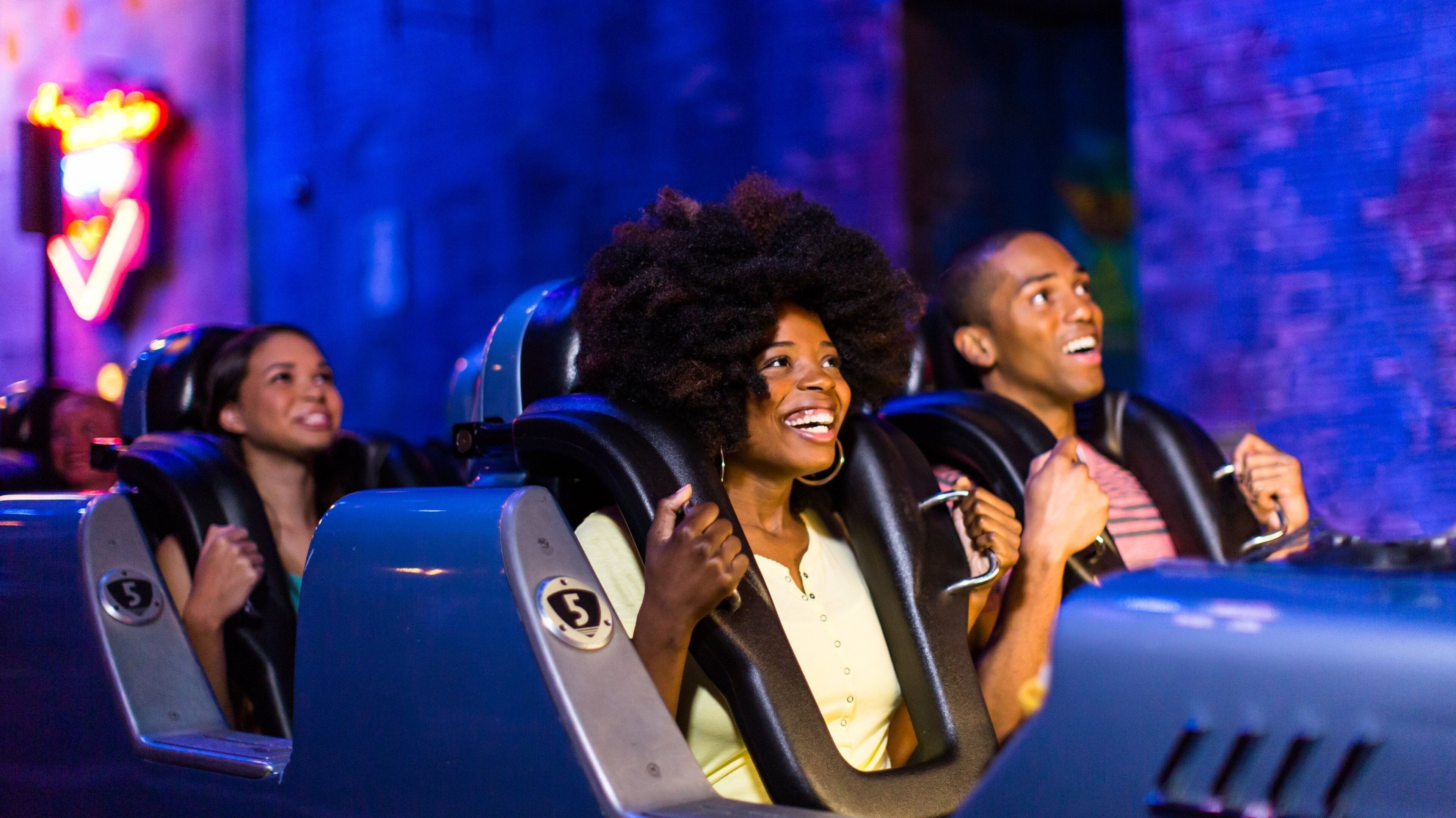 Disney\'s Hollywood Studios® showing rides as well as a family
