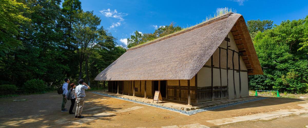 Museum of Japanese Houses which includes a house and heritage elements as well as a small group of people