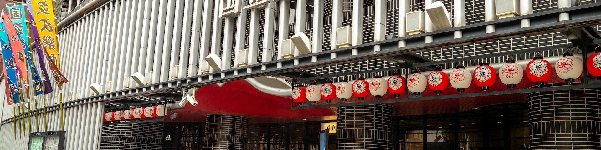 National Bunraku Theater featuring signage, street scenes and road cycling