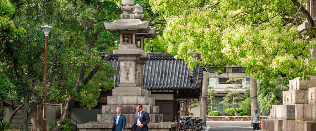 Sumiyoshi Taisha Shrine featuring heritage elements and street scenes as well as a couple