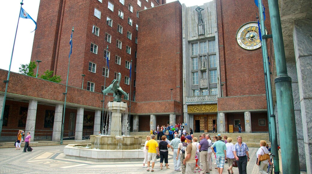 Oslo City Hall which includes a fountain, a square or plaza and an administrative building