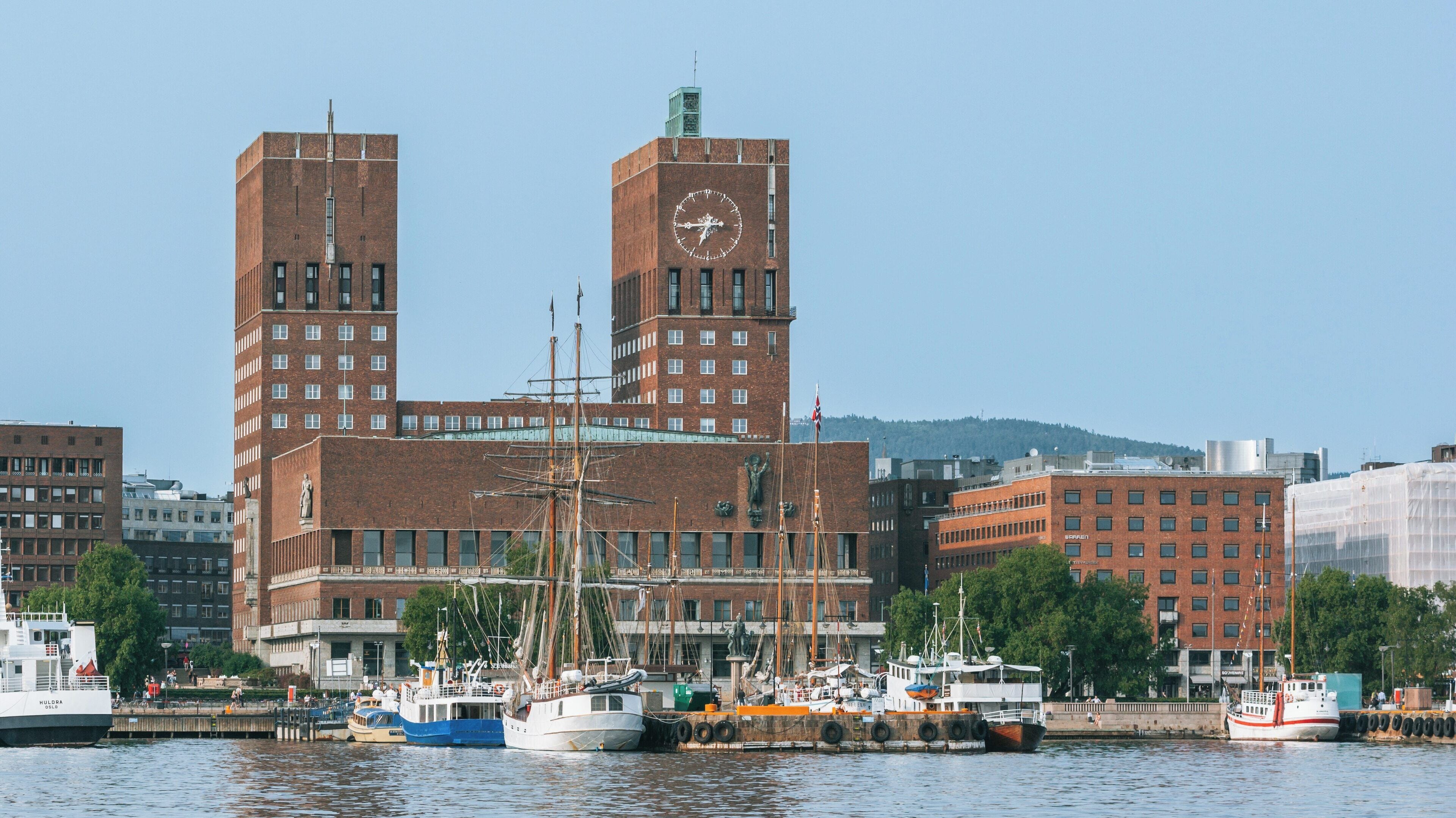 Oslo City Hall stands prominently along the waterfront in Central Oslo, Norway, reflecting the city's impressive architecture and maritime heritage