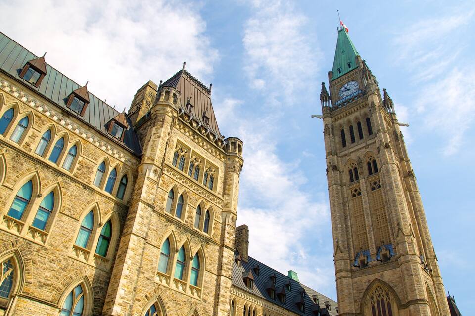 A historic building with a clock tower and arched windows.