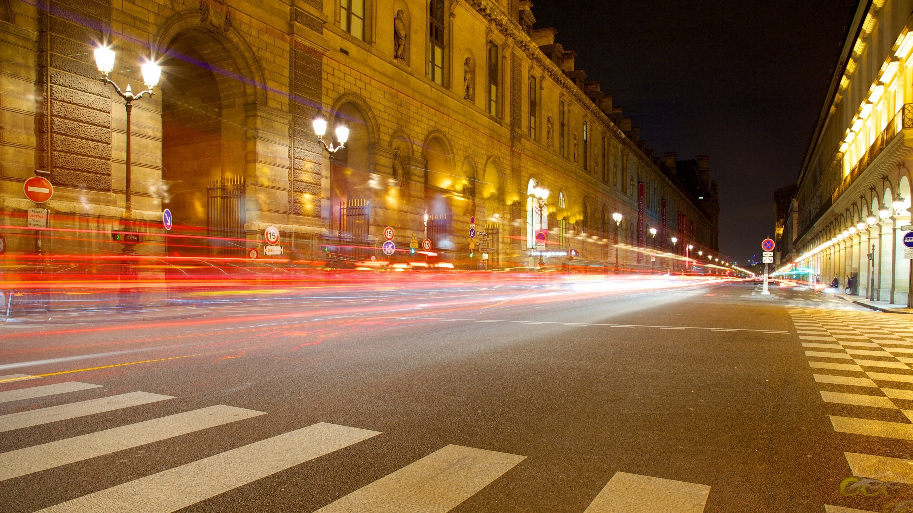 Louvre Museum showing night scenes, street scenes and a city