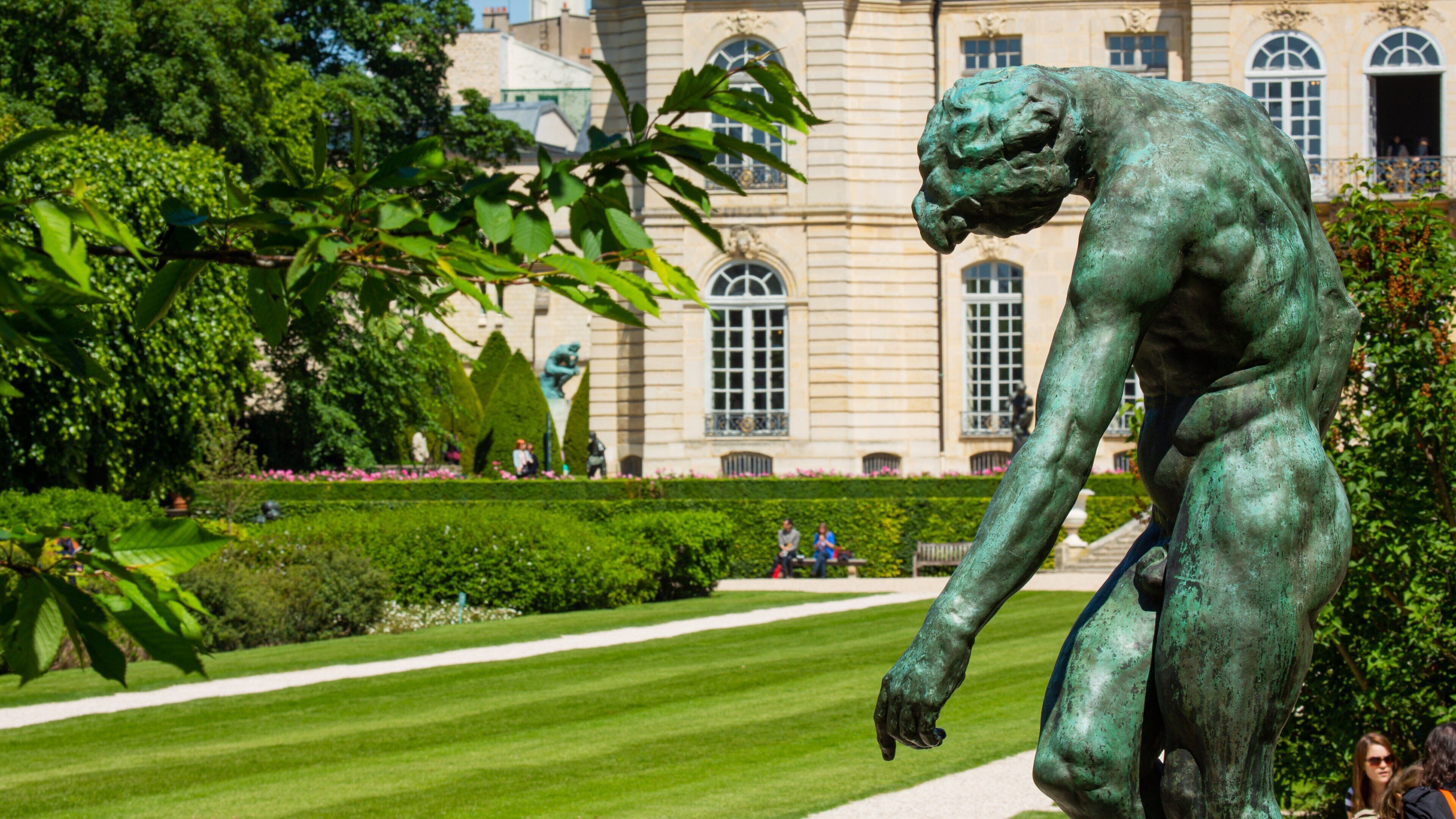 Rodin Museum featuring a statue or sculpture, a park and heritage architecture