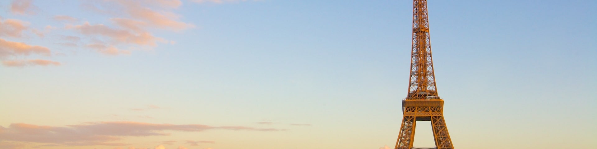 Eiffel Tower showing a sunset, a monument and heritage architecture