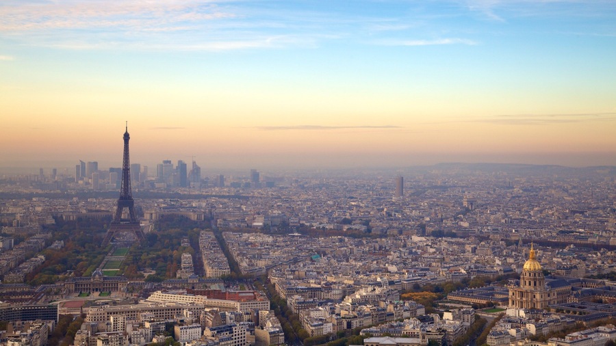 Stunning view of the Eiffel Tower in Paris during a serene evening with a vibrant skyline
