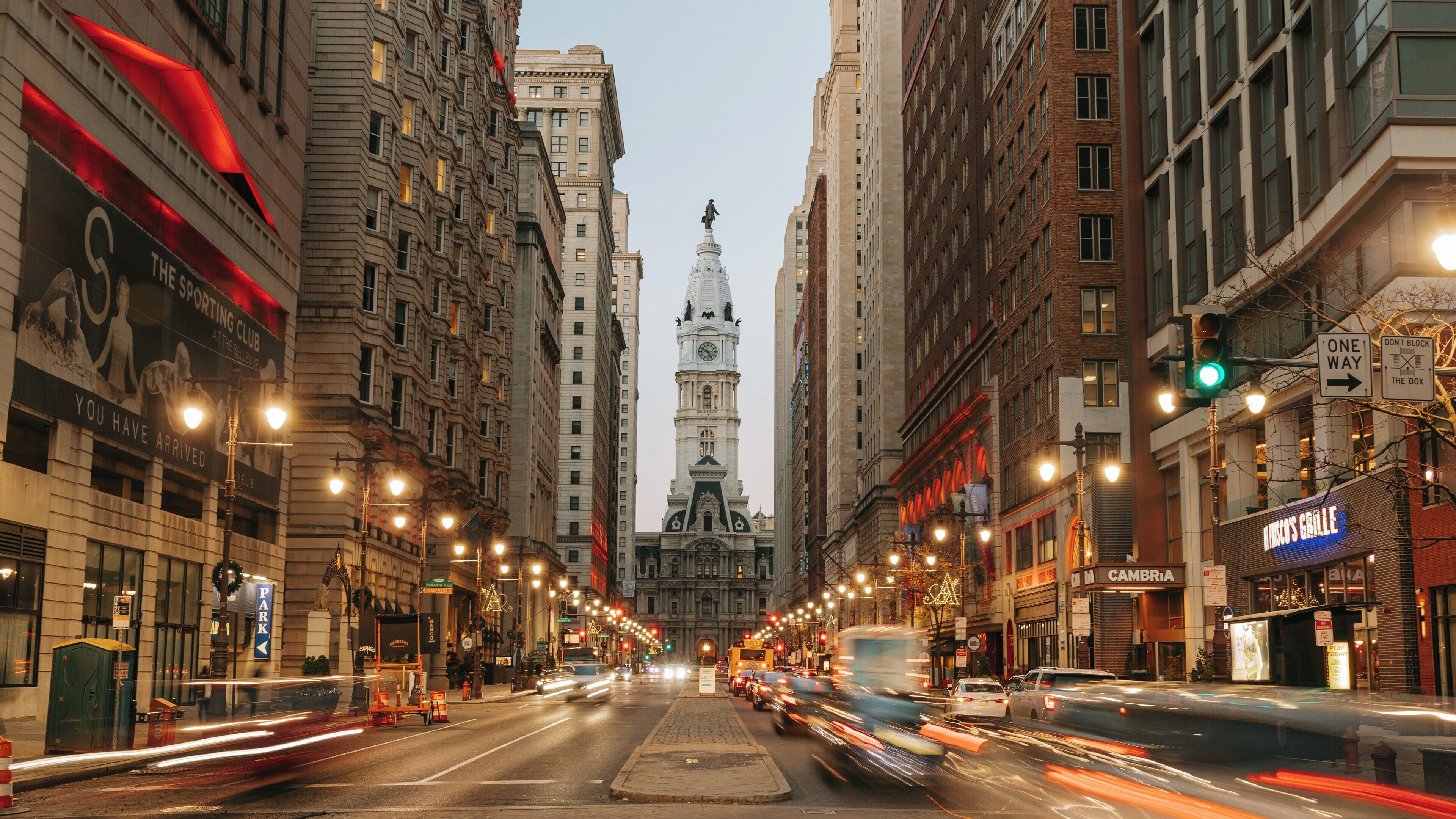 City Hall stands majestically at dusk in Center City, Philadelphia, Pennsylvania, showcasing its historical architecture amidst urban hustle and bustle