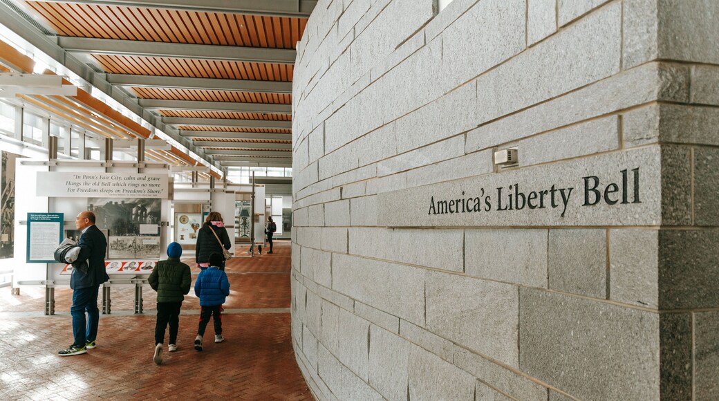 Liberty Bell Center showing interior views and signage as well as a family