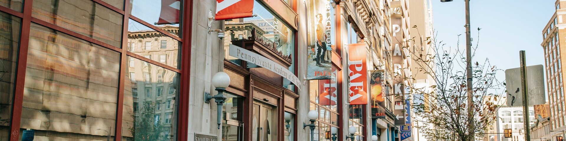 Pennsylvania Academy of the Fine Arts showing street scenes and a city