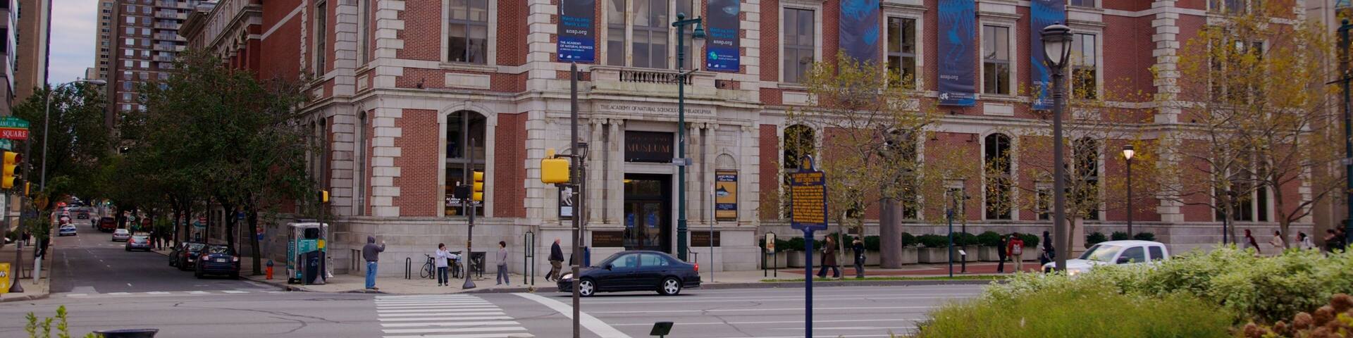 Academy of Natural Sciences which includes street scenes, a city and a skyscraper