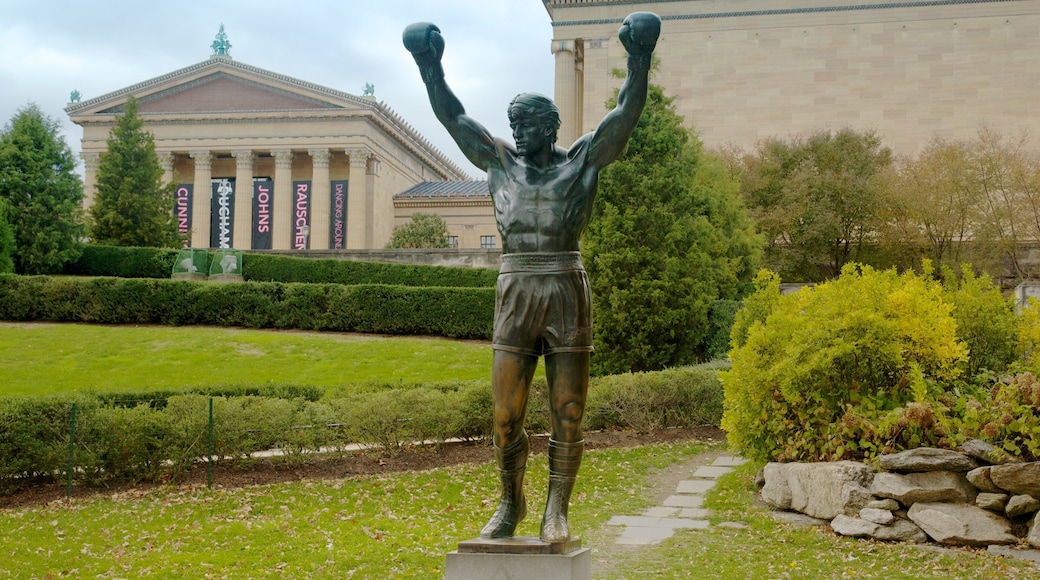 Iconic Rocky statue stands proudly outside the Philadelphia Museum of Art surrounded by lush greenery