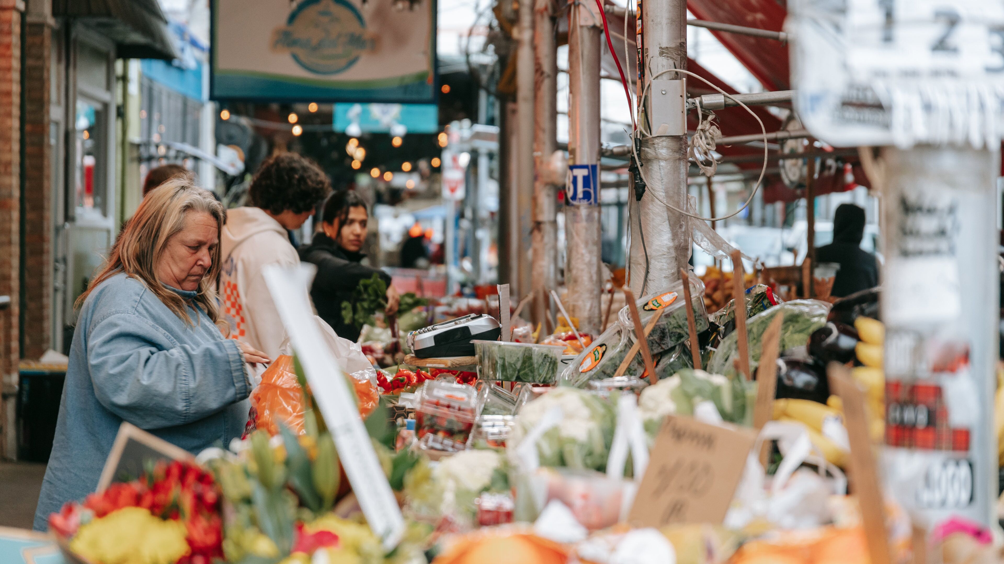 Italian Market featuring food and markets as well as an individual femail