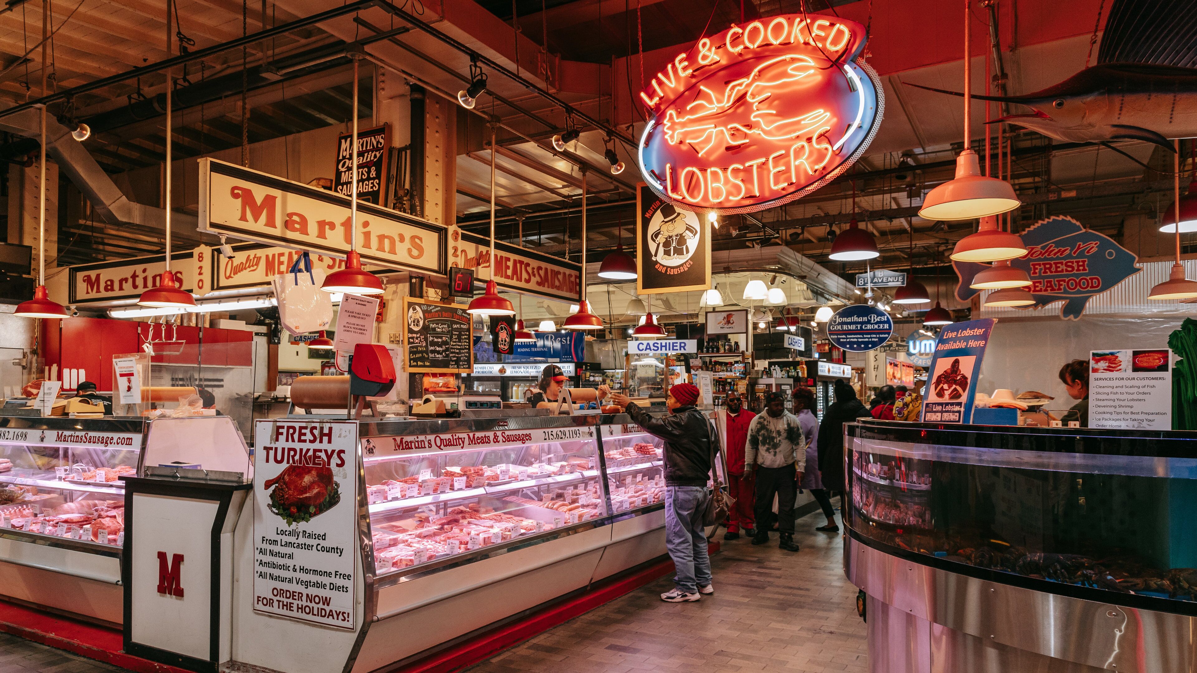 Reading Terminal Market which includes markets, signage and interior views
