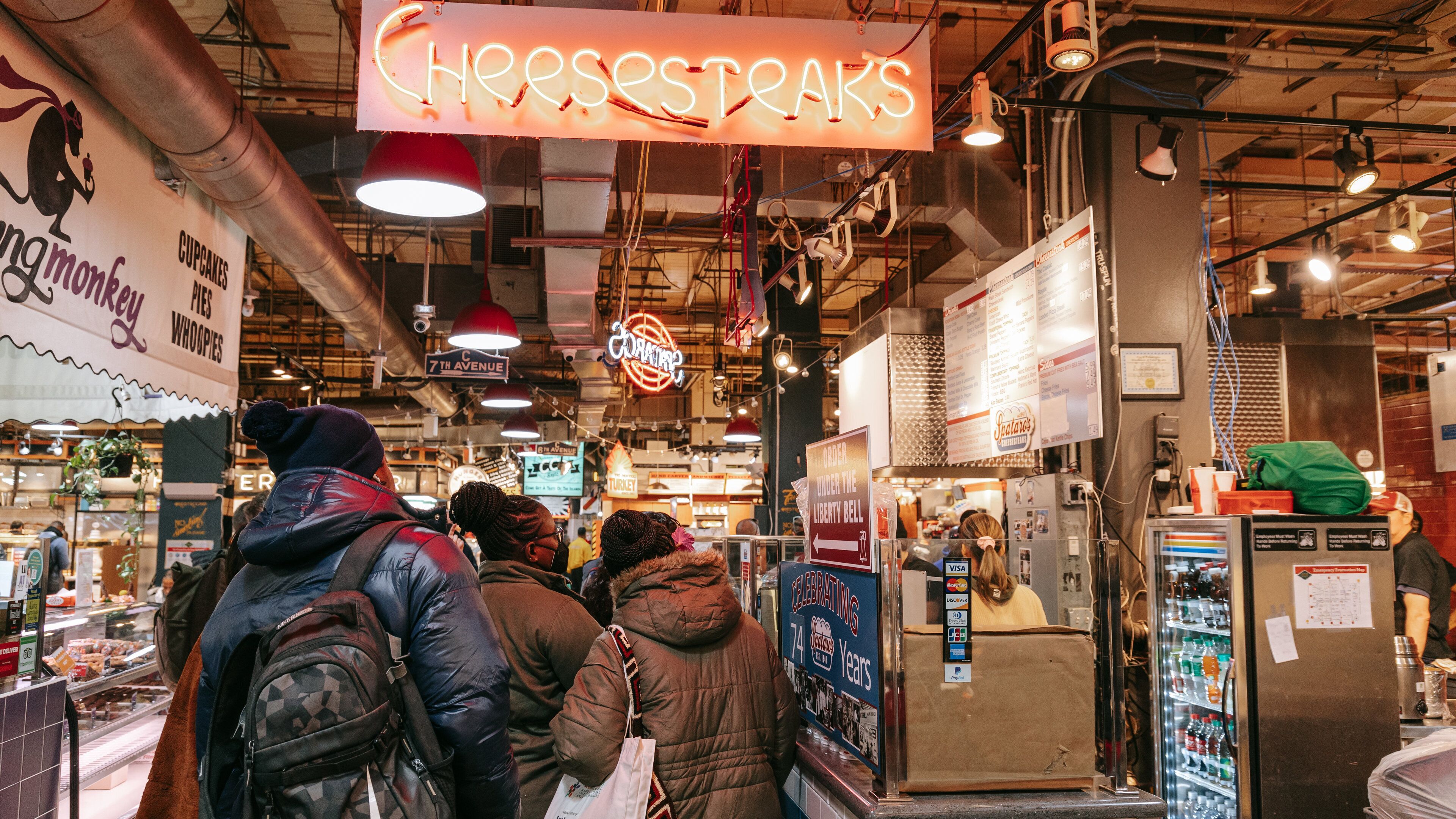 Reading Terminal Market featuring interior views, signage and markets
