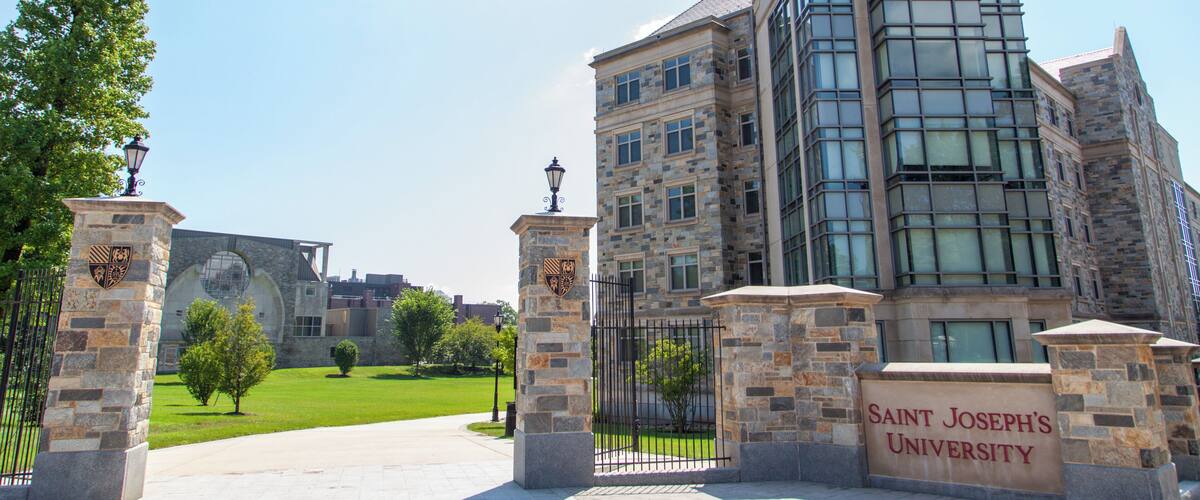 Saint Joseph's University building with stone architecture and a clear blue sky.