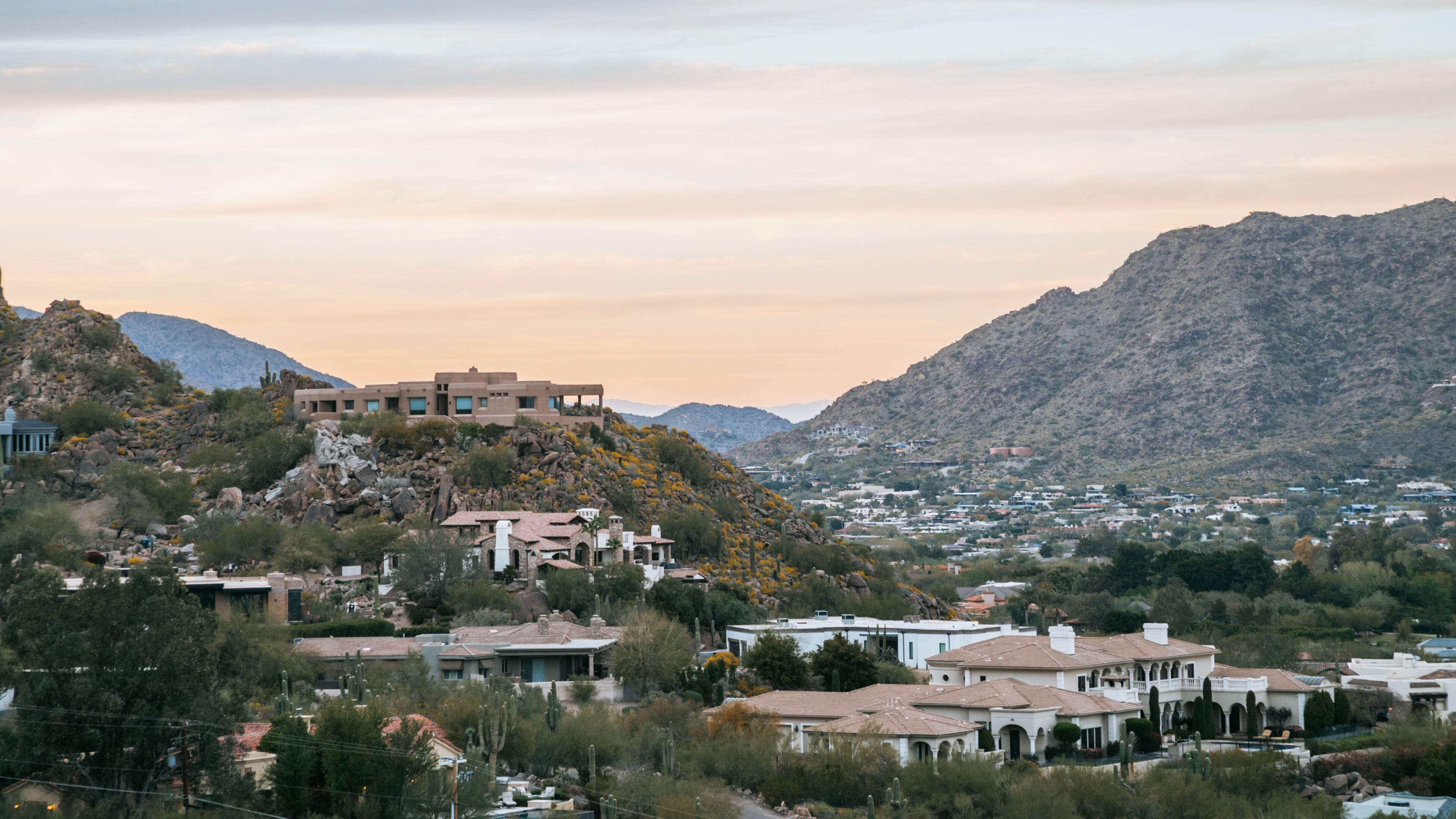 Camelback Mountain featuring a small town or village, a sunset and landscape views