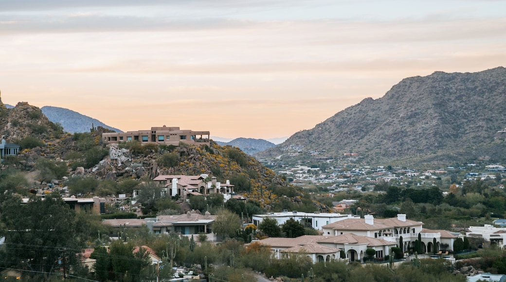 Camelback Mountain featuring a small town or village, a sunset and landscape views