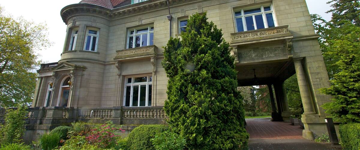 Pittock Mansion which includes a park, heritage architecture and a house