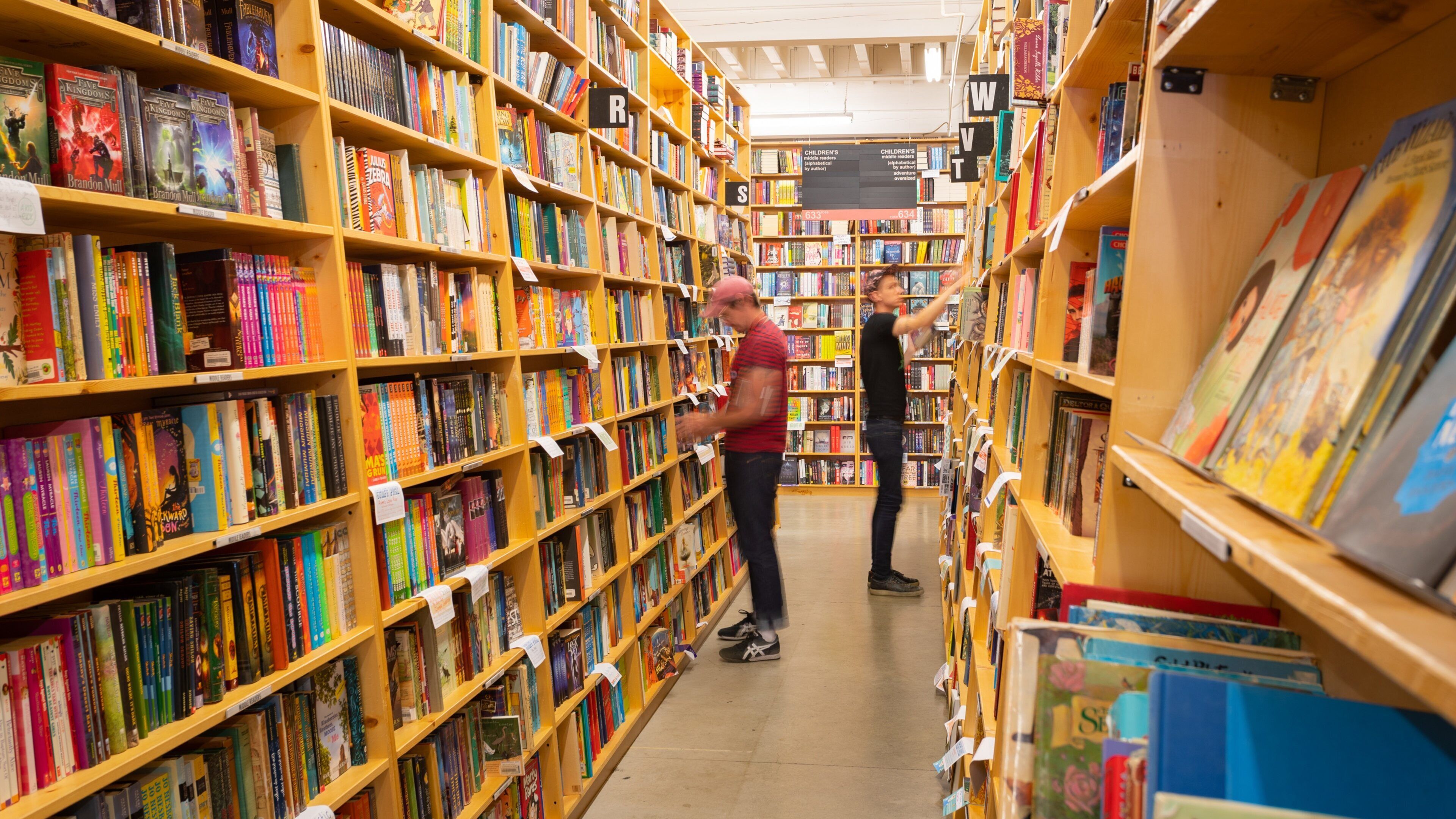 Powell\'s City of Books showing interior views as well as an individual male